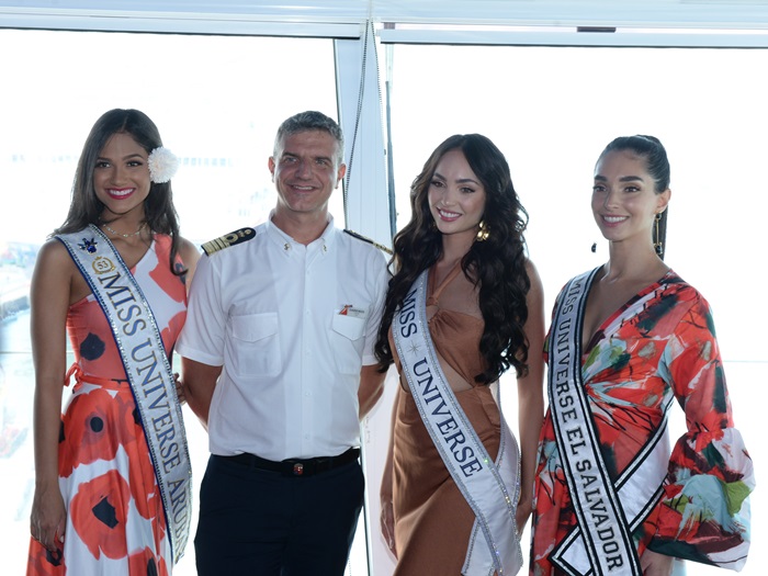 Miss Universe Titleholders pose with Captain Claudio Bozzo